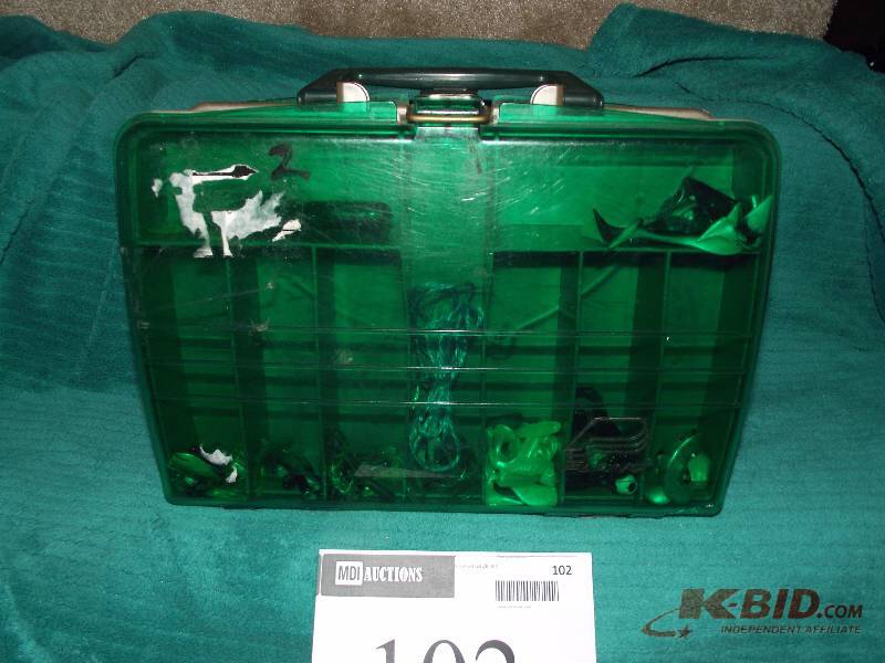 lot 102 image: Plano tackle box with assorted jigs and plastic baits