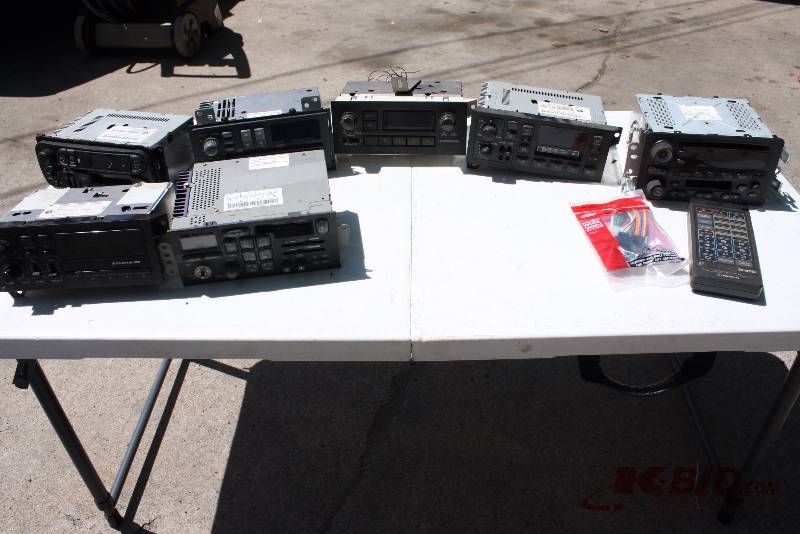 lot 48 image: Lot of (9) Including Car Audio Decks, (7) Remote Wiring Harness 88-05 GM 21 Pin.