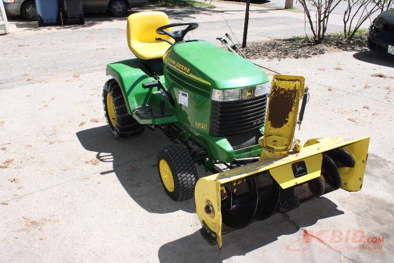 lot 2 image: 1997 John Deere 325 Yard Tractor with Snow Chains, Rear Weights and 42 snow blower