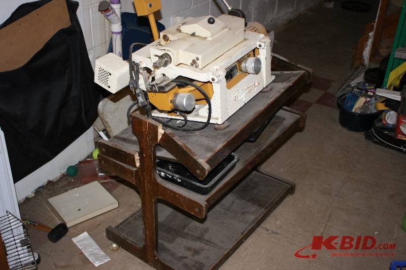 lot 8 image: Vintage Optical Glass Grinder on Table