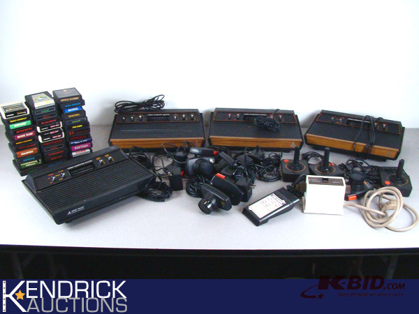 lot 43 image: 4 Vintage Atari Game Systems with Controllers, and Games