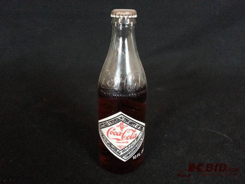 lot 41 image: 75th Anniversary Coca-Cola Unopened Bottle