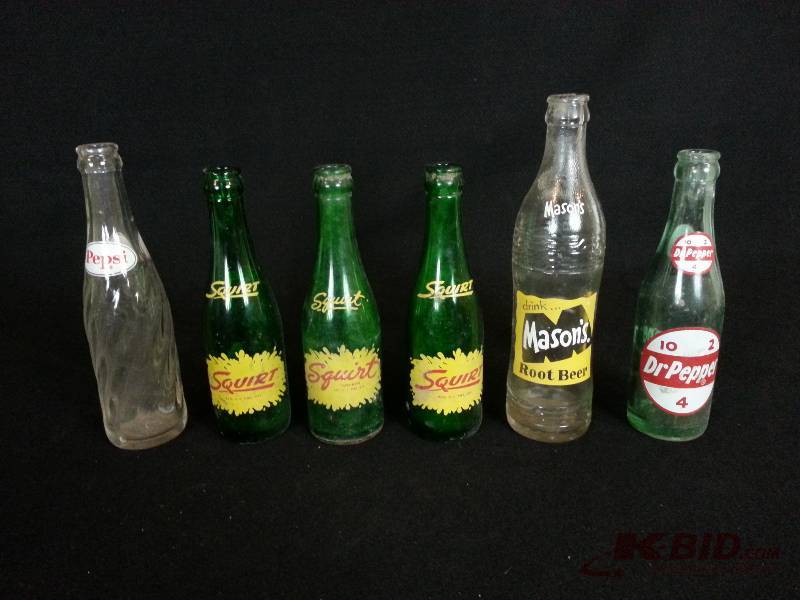 lot 42 image: Lot of (6) Vintage Pop  Soda Bottles - Squirt, Dr. Pepper, Etc.