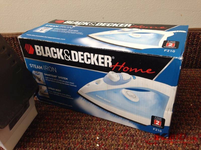 lot 6 image: Black & Decker Steam Iron. Iron was previ...