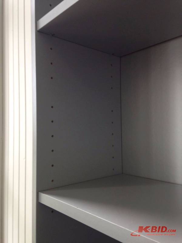 lot 23 image: Gray bookshelf. Shelf height adjustable. Meas...