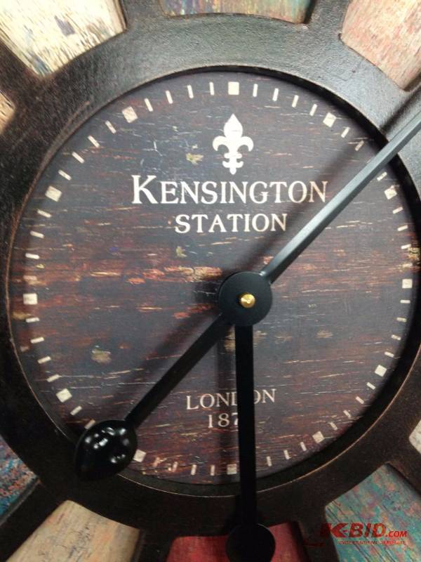 lot 25 image: Battery operated wall clock. Measures 31 12i...