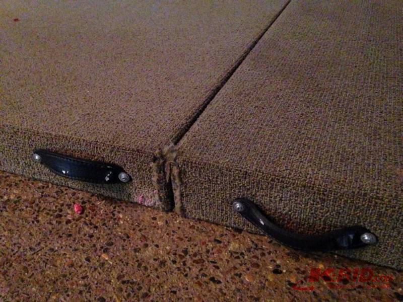 lot 33 image: 2 piece stage platform. Carpeted. Some wear t...
