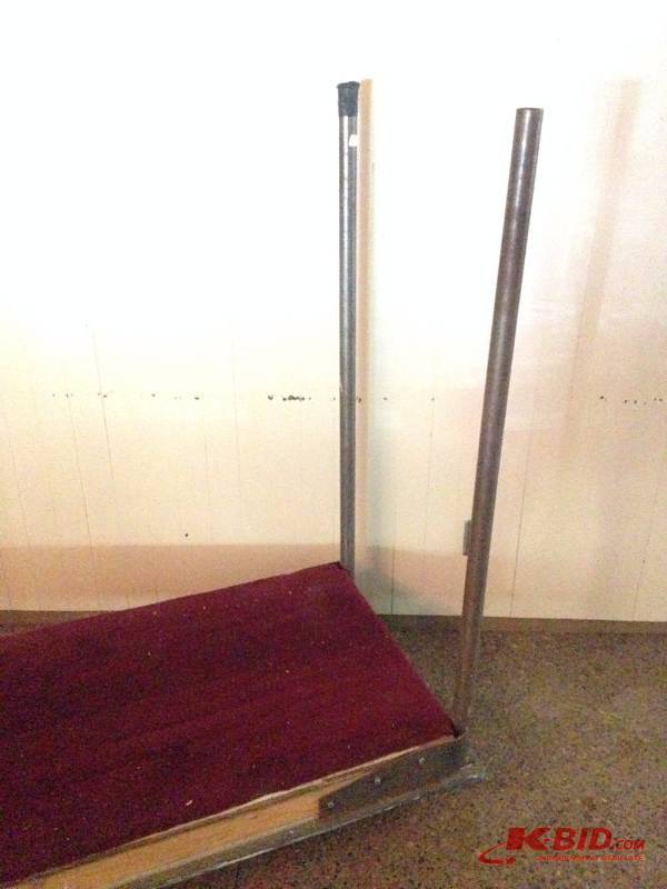 lot 34 image: 4 wheel moving cart. 26 12in wide by 72in. C...