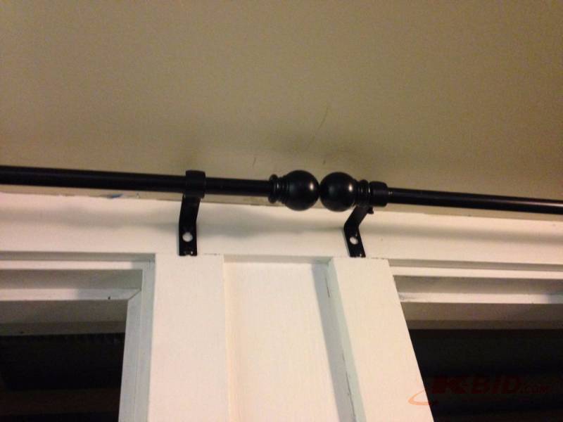 lot 52 image: 3 fabric curtains with 2 rods. One knob on ro...
