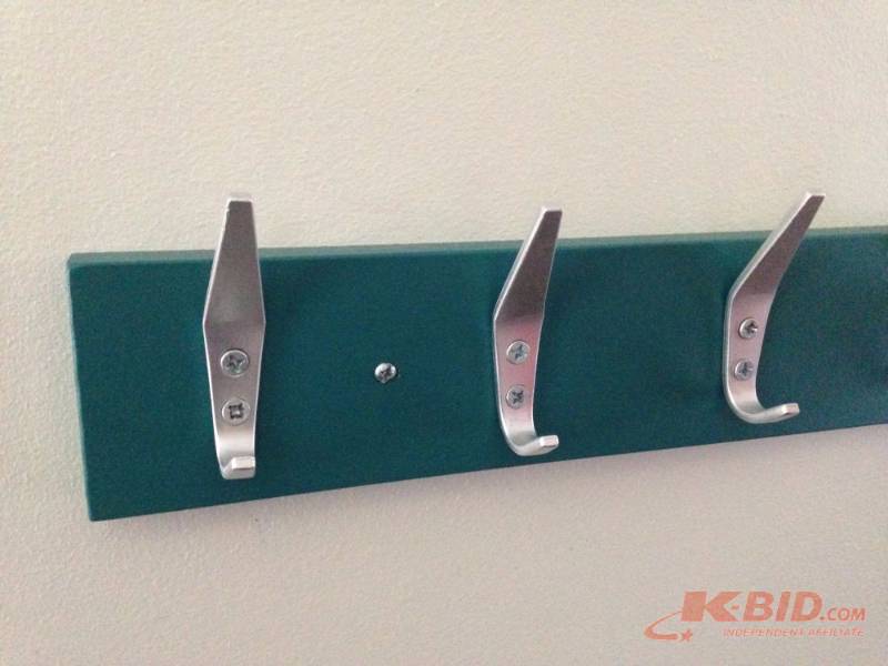 lot 61 image: Pine coat rack painted teal. Measures 32in wi...
