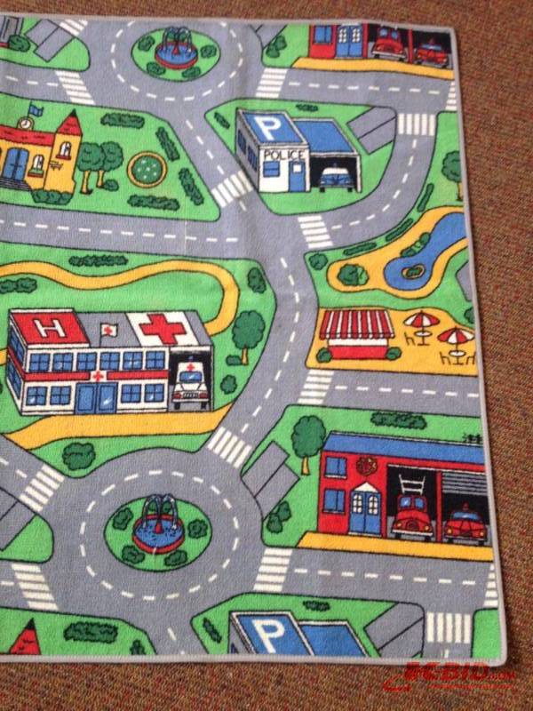 lot 125 image: Childrens transportation rug. Measuring 6ft b...