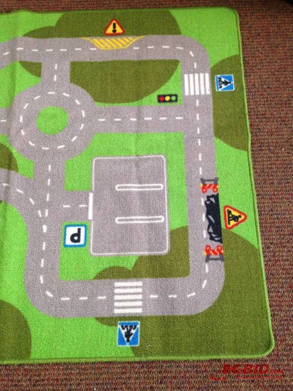 lot 126 image: Childrens transportation rug. Measuring 52in...