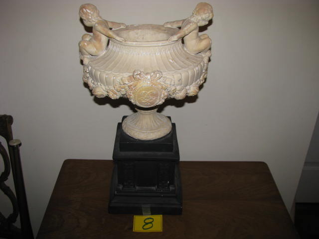 Cherub mounted vase on pedastal