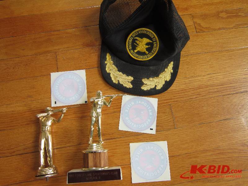 Lot of trophies and NRA decals and ...