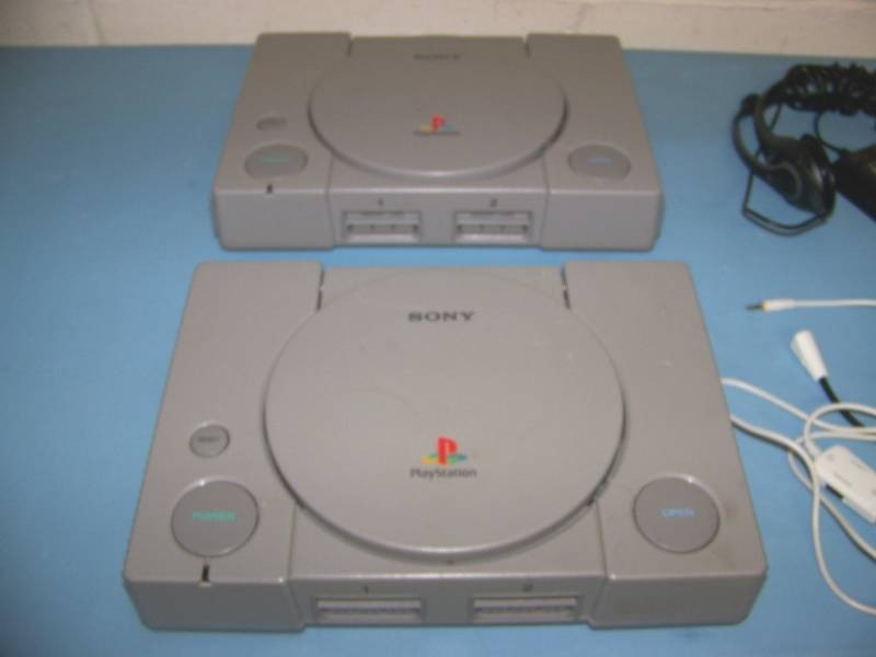 (2) Sony, Playstation Gaming Consoles with (2) Headphones and (3) Games