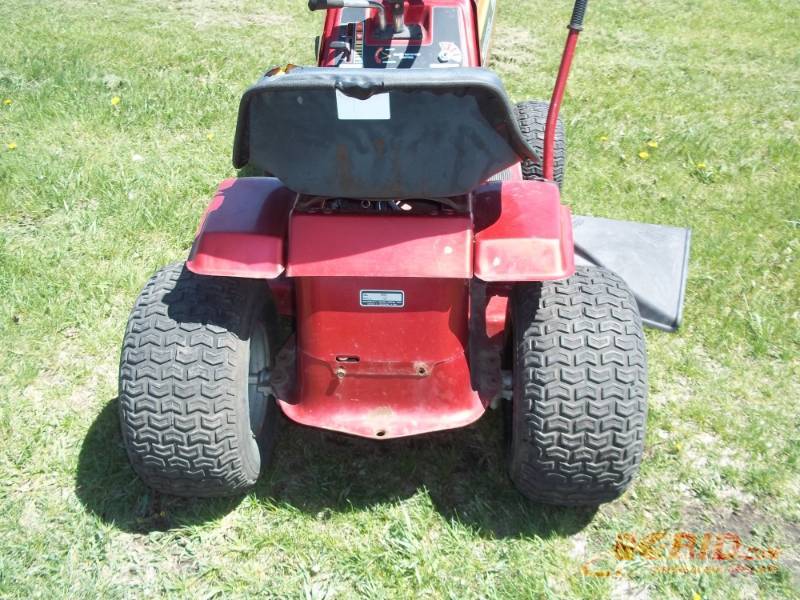 lot 1 image: Murry riding mower 12HP Briggs, 38 deck 5 forward speeds, 1 reverse speed Consignor states runs, drives and mows, needs battery