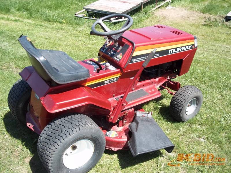 lot 4 image: Murry riding mower 12HP Tecumseh, 38 deck 5 forward speeds, 1 reverse speed Consignor states runs, drives and mows, needs battery