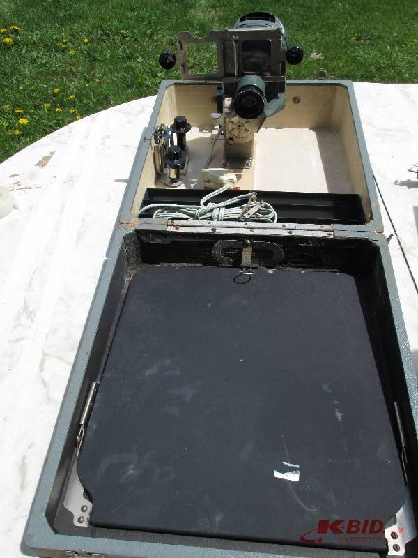 lot 43 image: Vintage projector that folds into t...