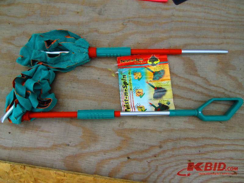 Pair of Twist N Spin microfiber mop...