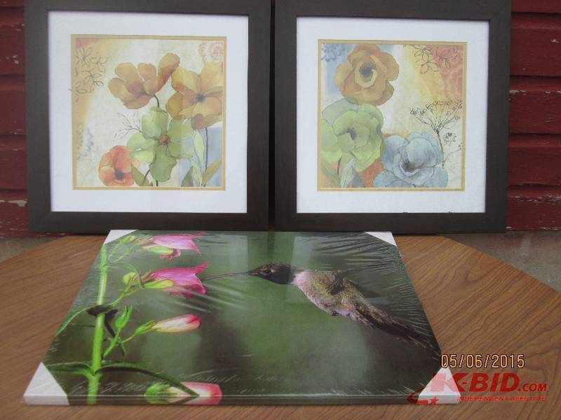 Floral prints framed in dark wood. ...