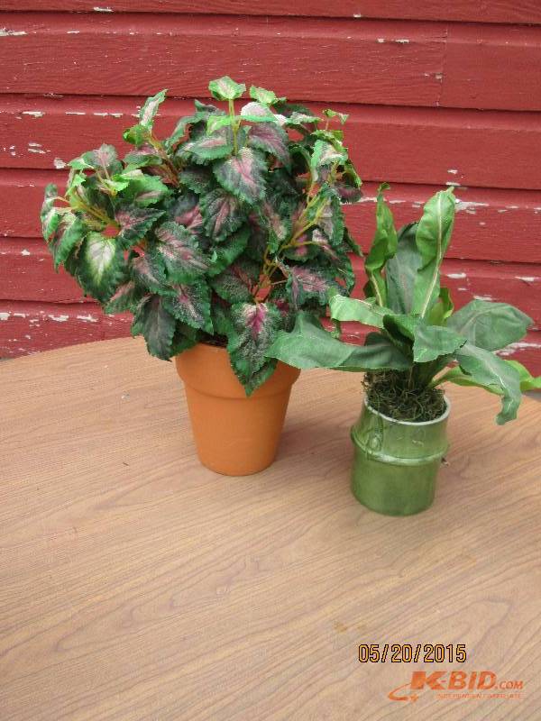 Pair of artificial potted plants...