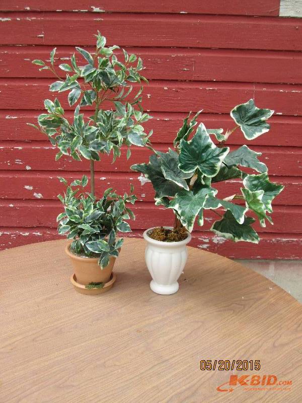 Nice pair of artificial  potted top...