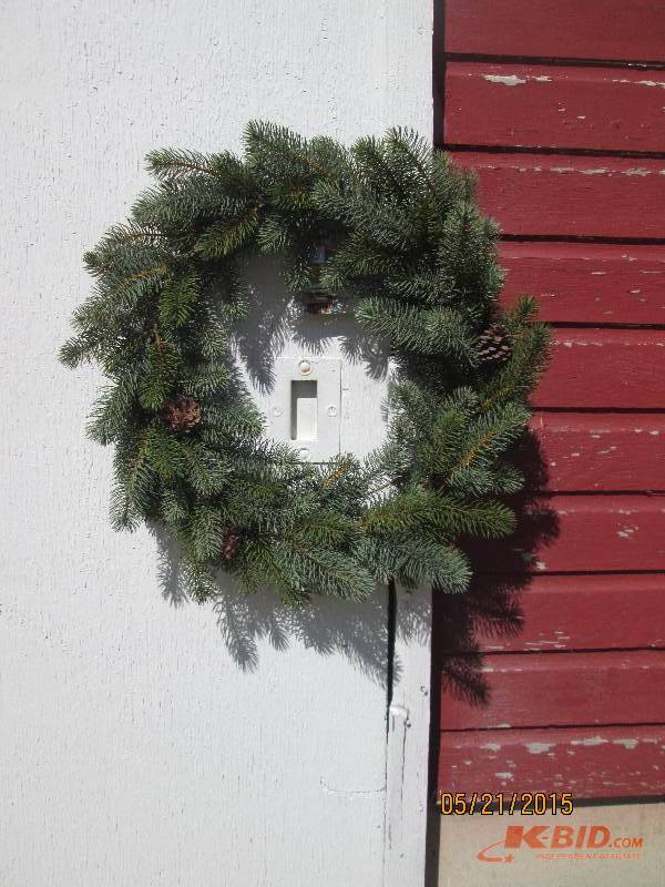 Large wreath decorated with pine co...