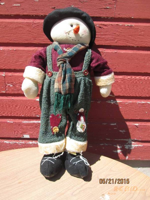 Snowman dressed in country attire. ...