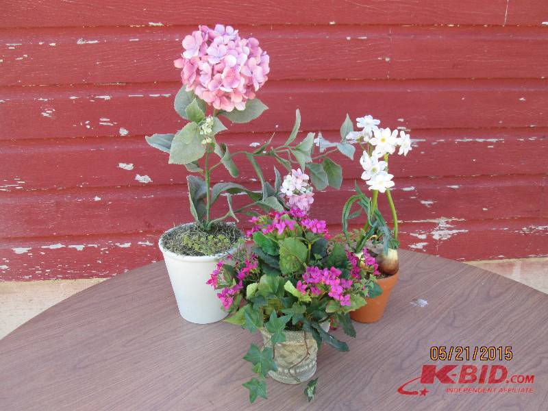 Trio of artificial potted plants...
