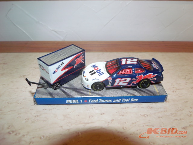 Lot of two 164 scale Ryan Newman  Mobil 1 cars with pit boxes on stands.