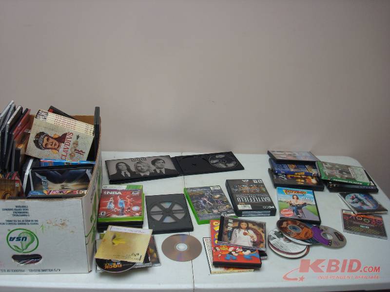 lot 21 image: Lot Of DVDs Some CDs, Some Show Wear, Scratched
