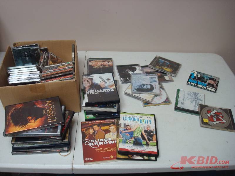 lot 24 image: Lot Of DVDs And CDs, Some Show Wear, Scratched
