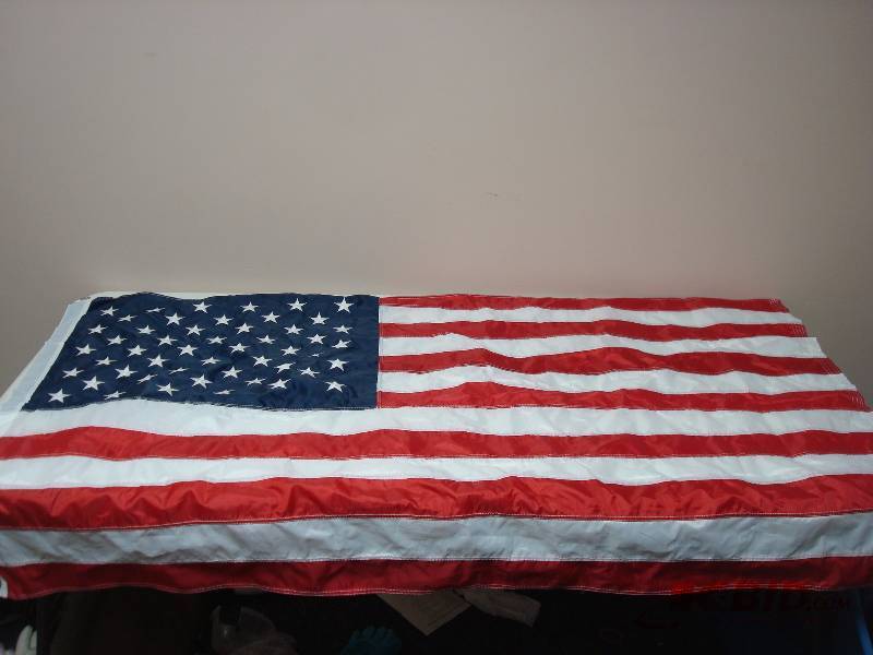 lot 105 image: Vinyl American Flag, Good Condition, Five Foot Long