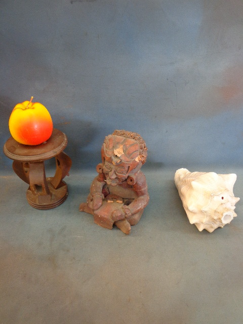 wooden candle holder, clay statue, seashell