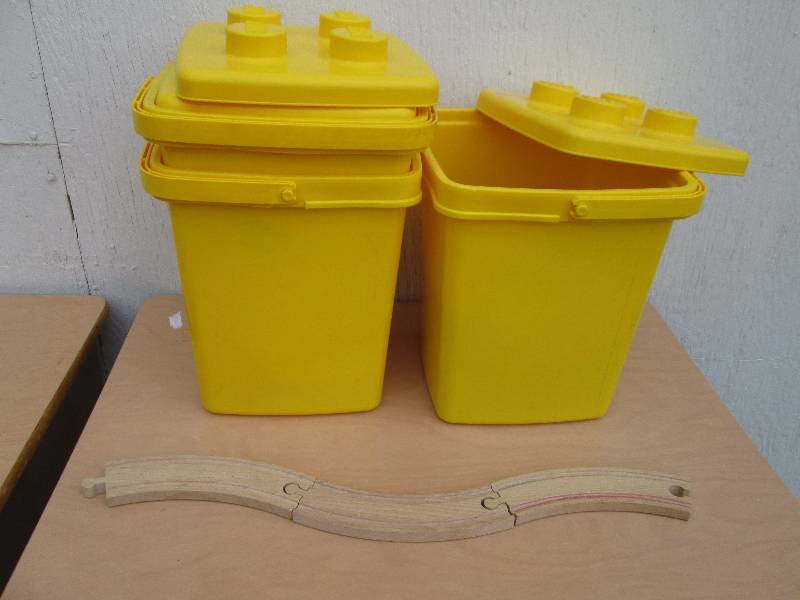 2 plastic bins and a wood track...