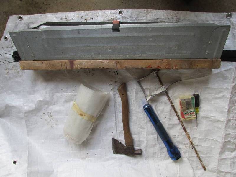 Folding saw horse, hatchet, maglite...