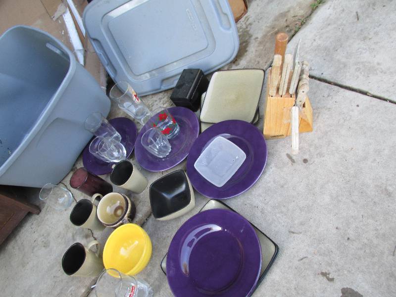 Dishes and a Faberware knife set in...