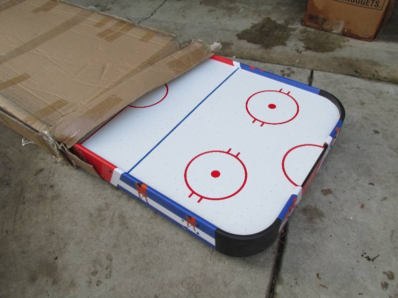 Brand new air hockey game, legs are...
