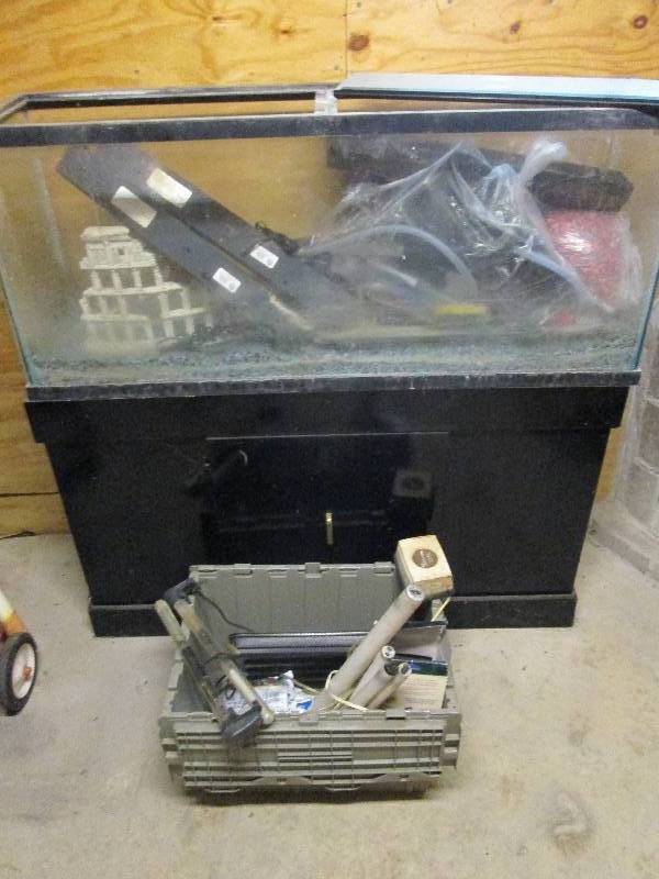Large fish aquarium on stand with a...