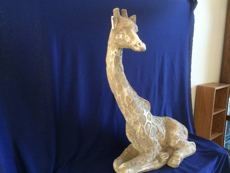 lot 53 image: This Giraffe Looks Great In Front Of A Fireplace