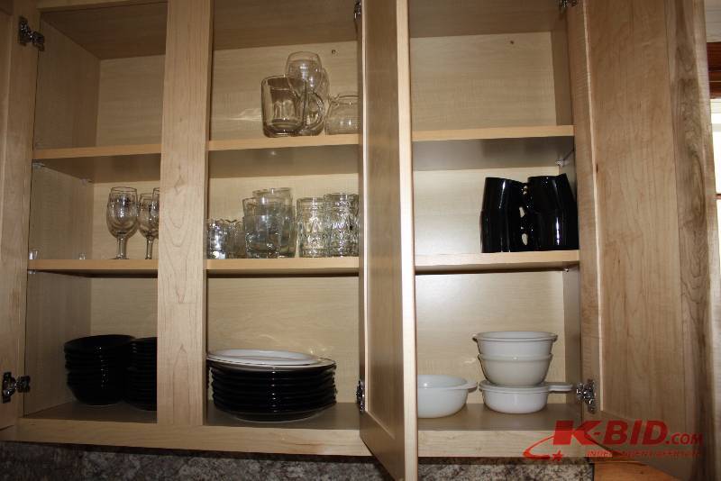 Cupboard Lot Including Glasses Baking Pans Bakeware And More.
