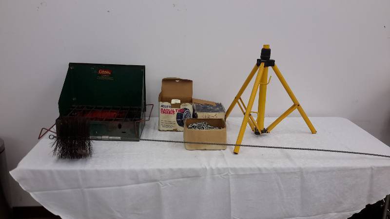 lot 46 image: stove, tire chains, chimney sweep, tripod