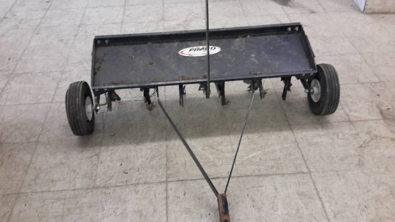 lot 116 image: pull behind lawn aerator