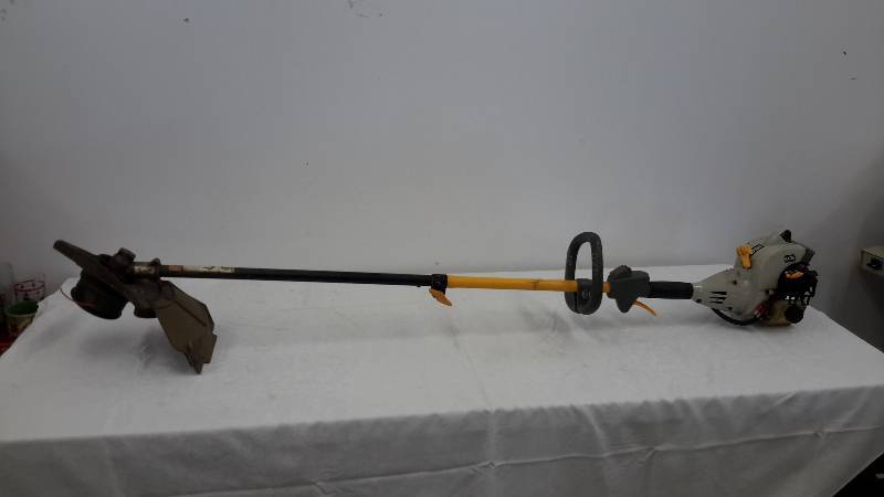 lot 121 image: ryobi trimmer
