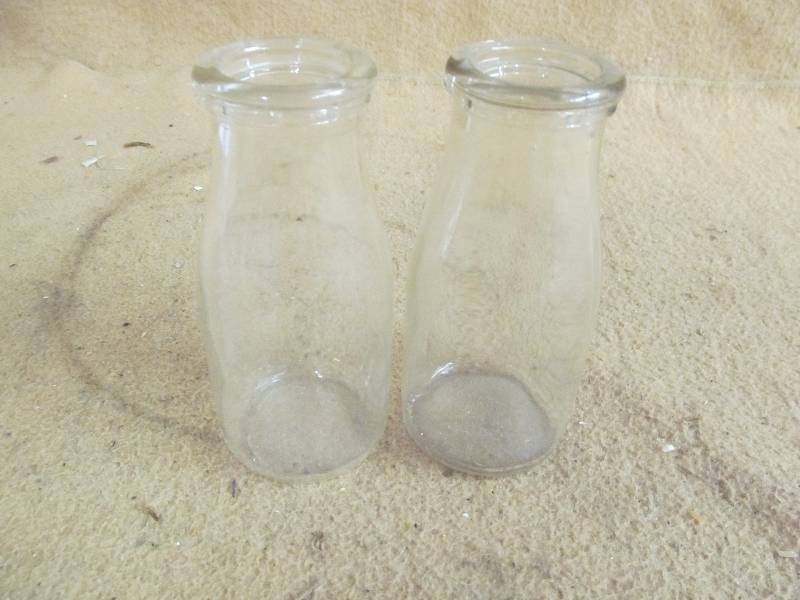 lot 48 image: Vintage milk jars