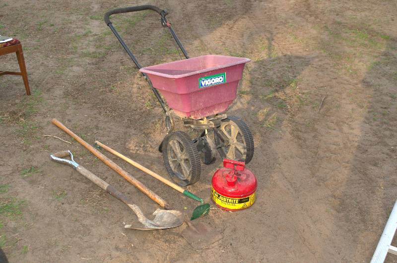 lot 26 image: LOT CONTAINING SPREADER, SHOVEL, HOE, GAS CAN AND CHIPPER.