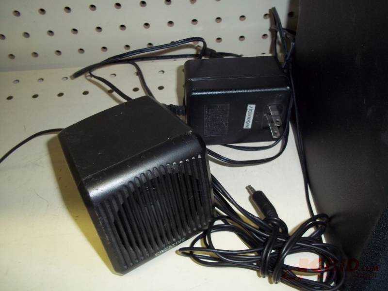 Speakers with cords and power unit