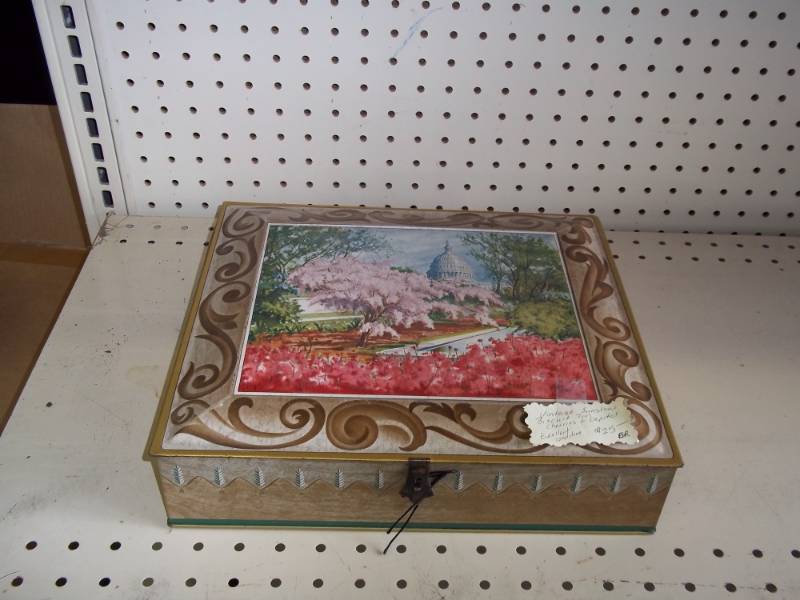 lot 56 image: Vintage sunshine biscuit tin cherries and capitol