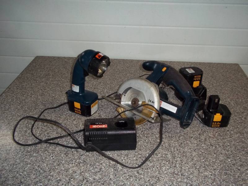 lot 111 image: Ryobi cordless saw and light with batteries and charger