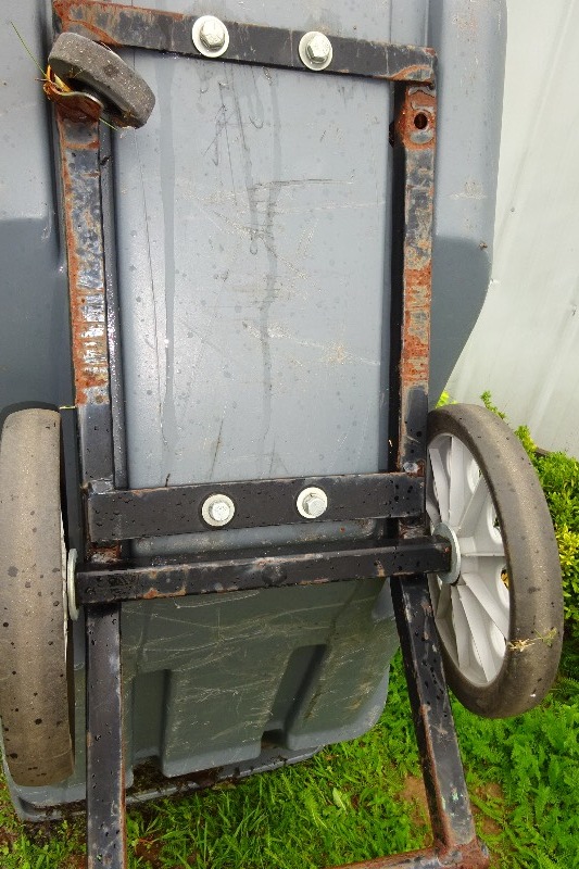 lot 7 image: Rubbermaid Roller Trash Can